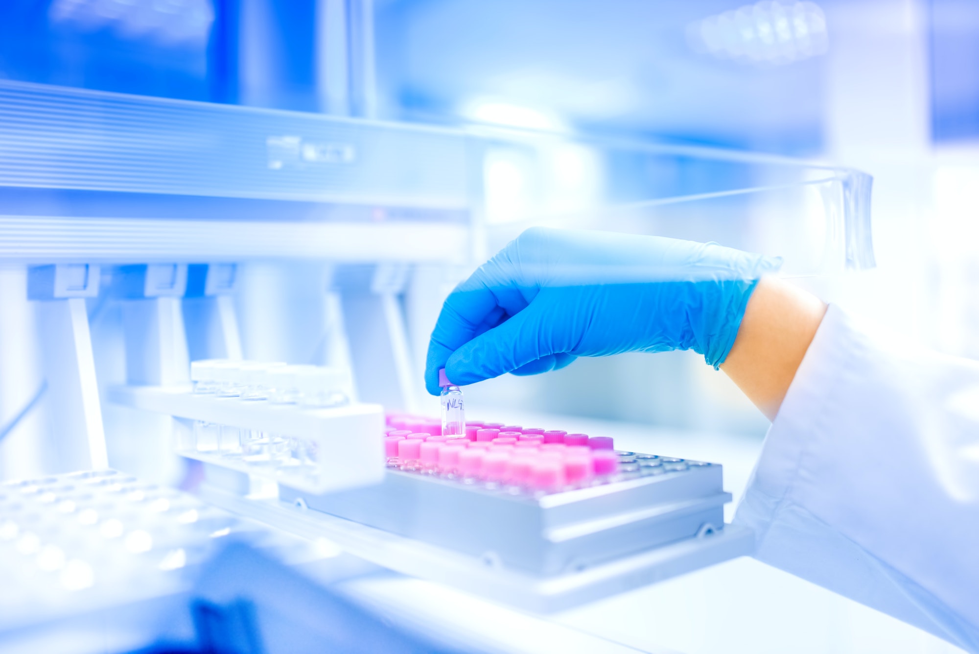 Scientist hand holding sample in special laboratory, medical enviroment, hospital details and tools